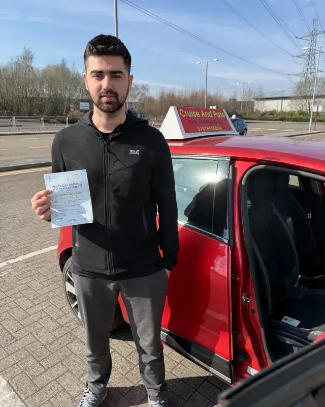 New driver holding a pass certificate after lessons in Bury with Cruise'N'Pass