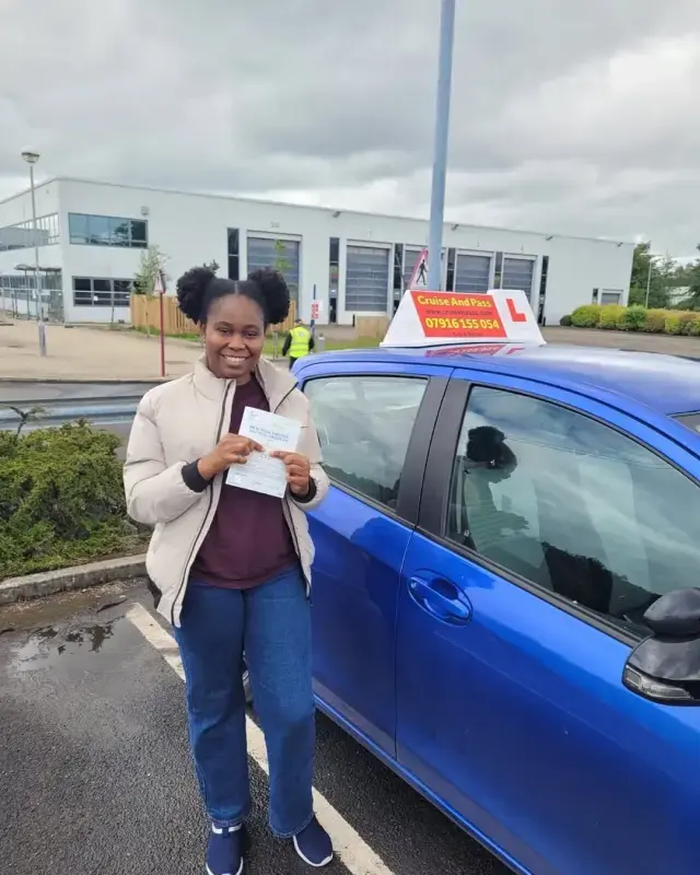 Driving instructor coaching a learner through a Manchester test route